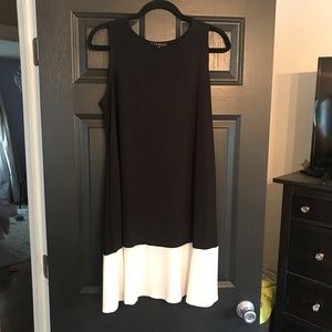 Sleeveless black dress with white bottom